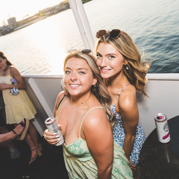 a person standing next to a body of water