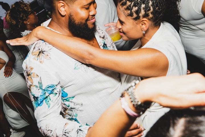 a man and a woman standing in front of a crowd