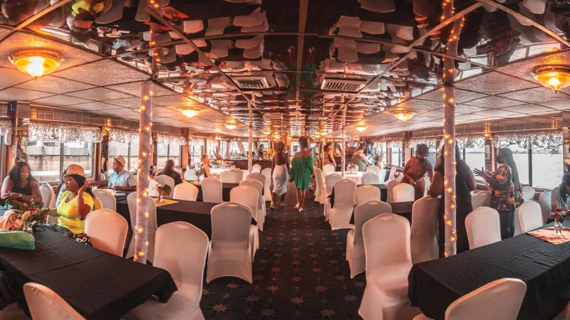a group of people sitting at a table in a restaurant
