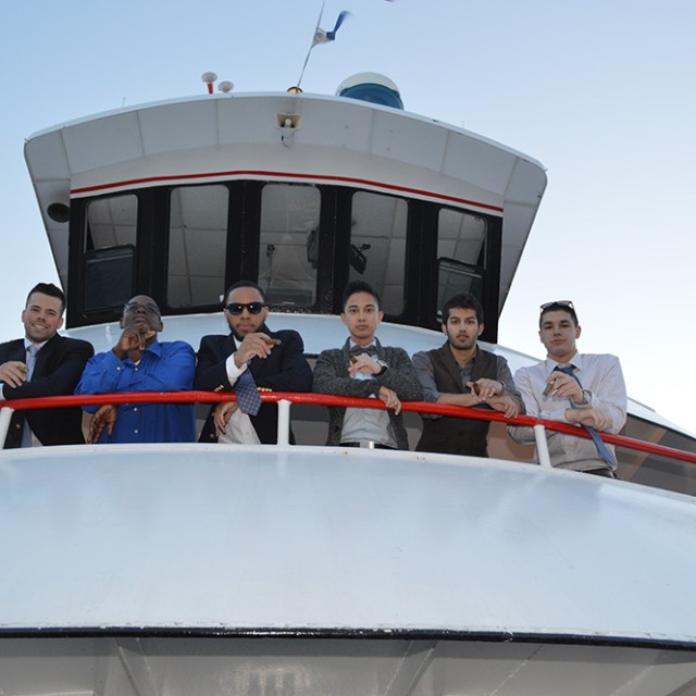 a group of people riding on the back of a boat