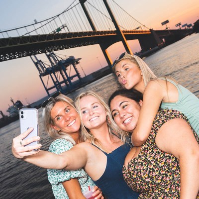 a woman sitting on a boat posing for the camera