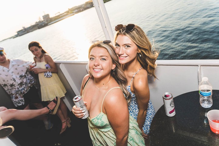 a person standing next to a body of water