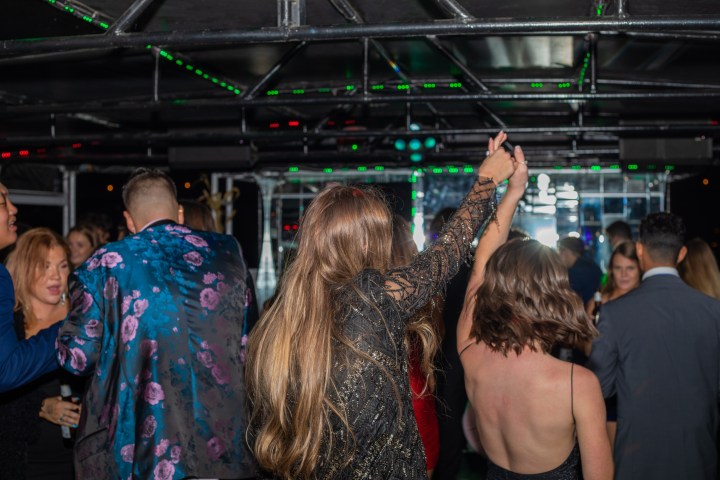 a group of people standing in front of a crowd