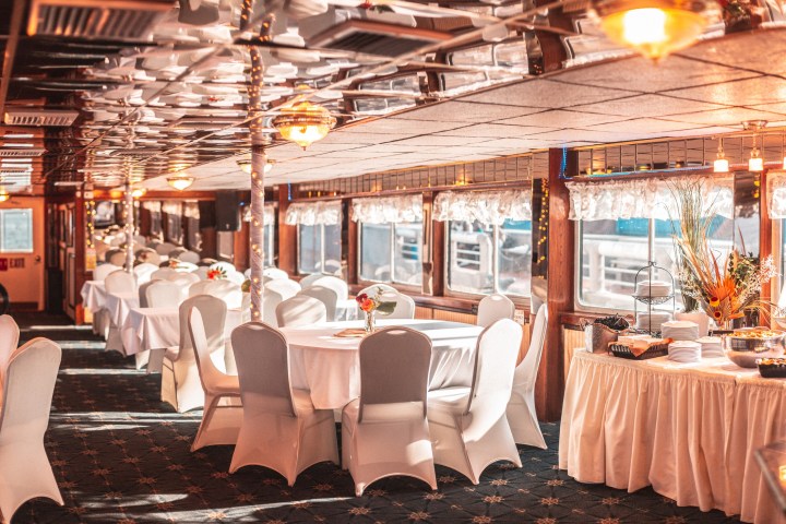 a group of people sitting at a table in a restaurant