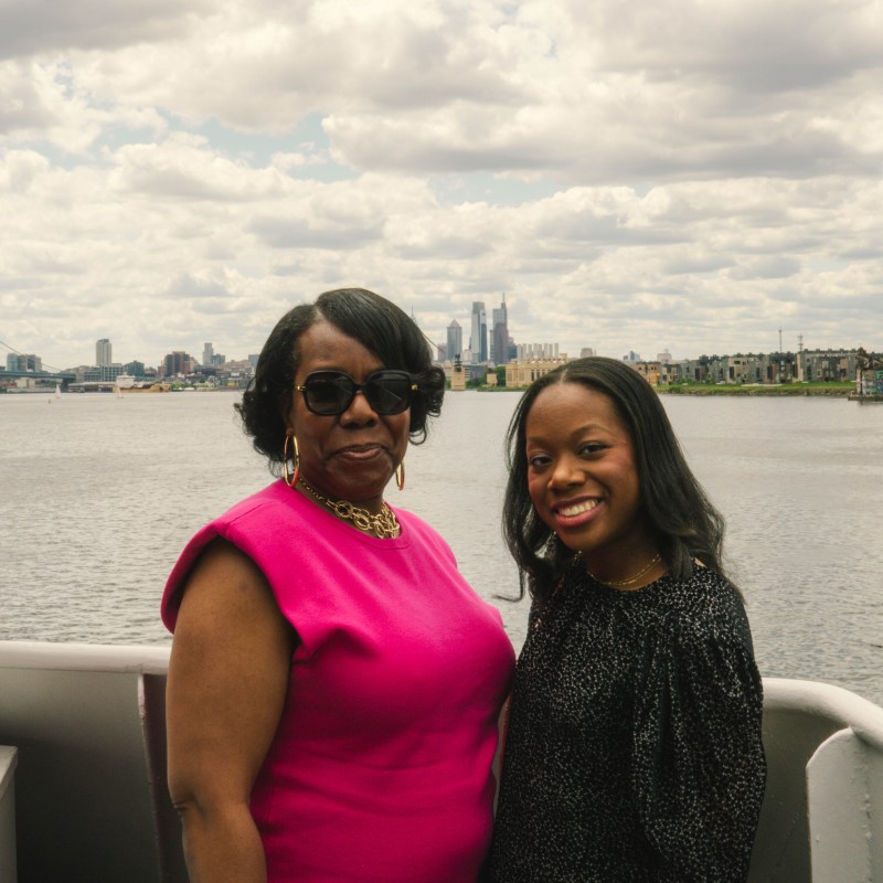 Brenda Dziadaszek et al. standing in front of a body of water
