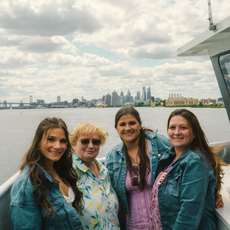 a person standing in front of a group of people posing for the camera